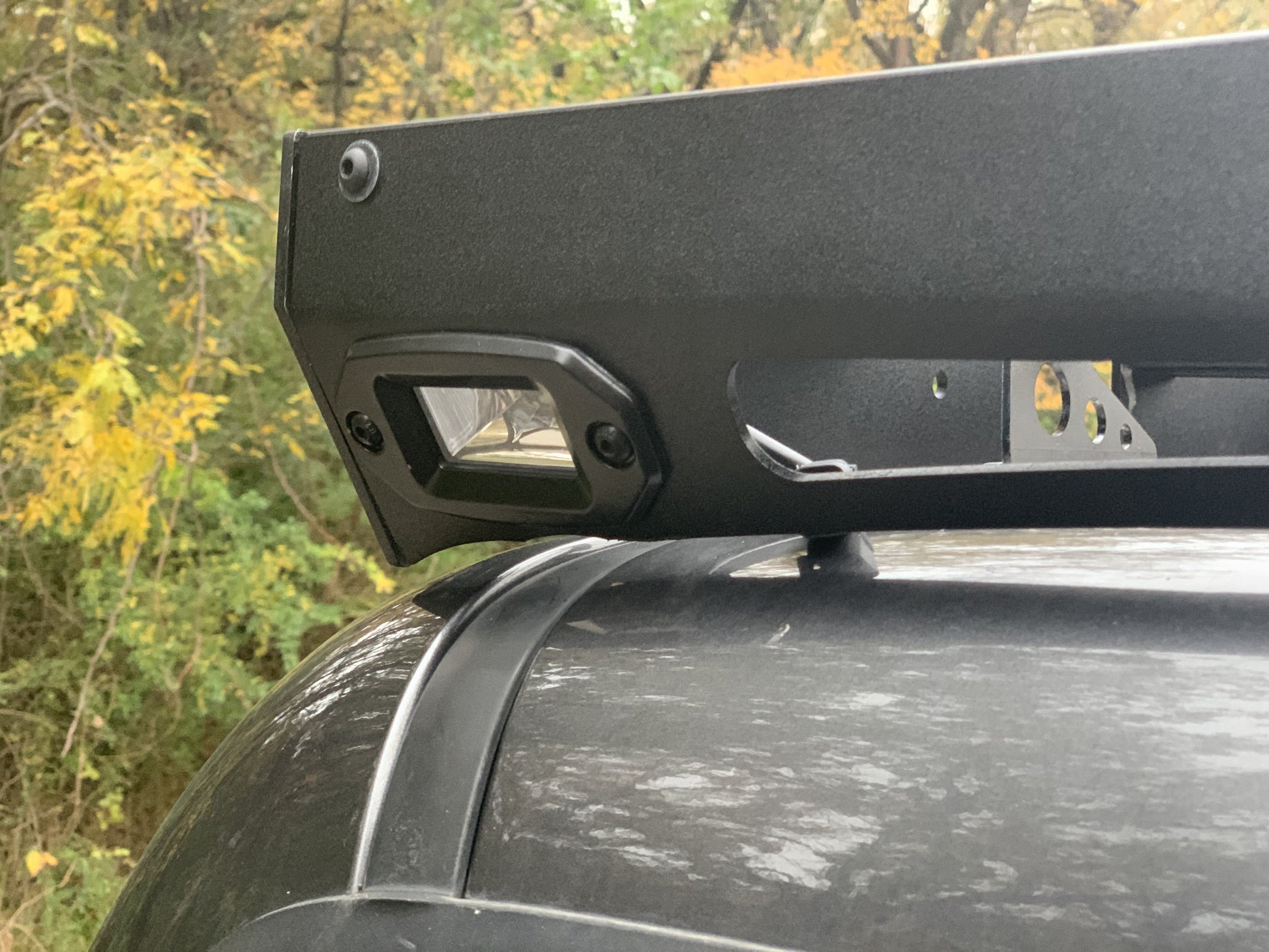 Close up rear view of gray Toyota Tacoma with Premium roof rack - Cali Raised LED